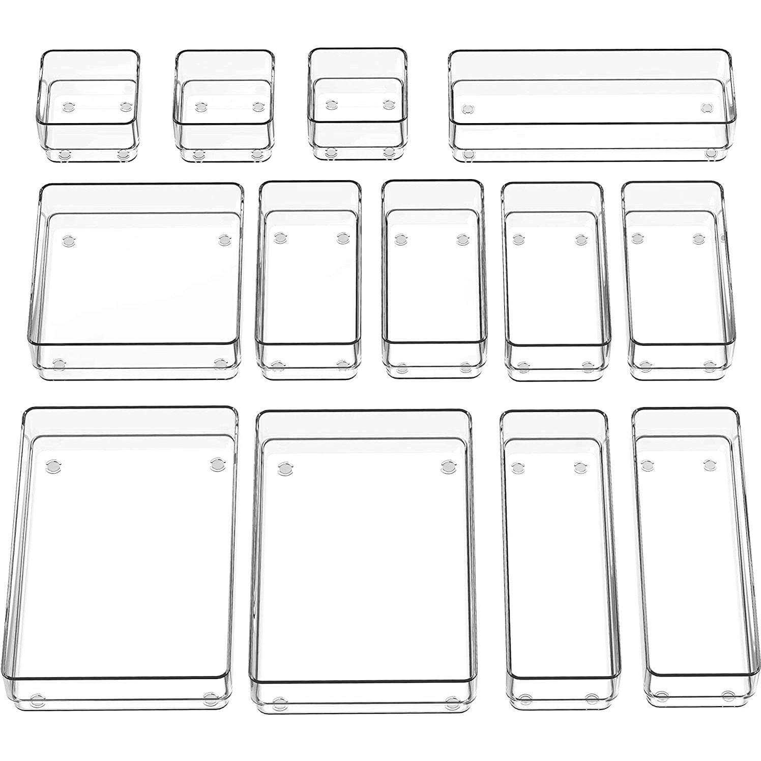 A set of stackable drawer bins in various sizes made of clear plastic.
